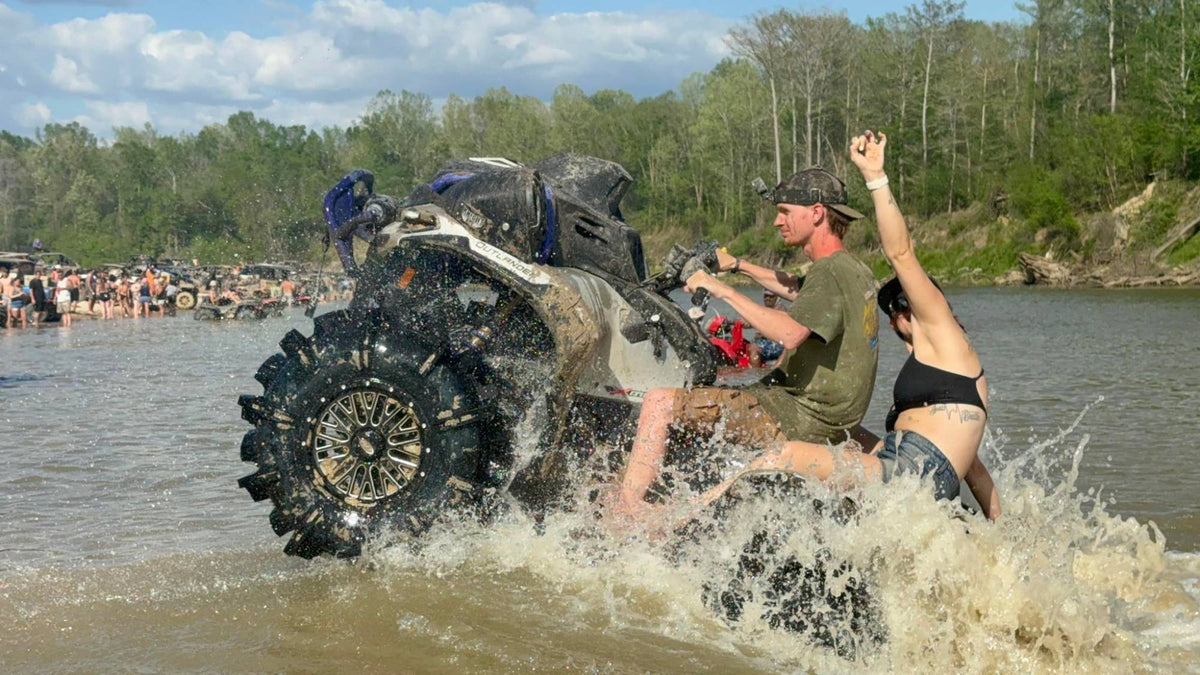 West TN Mudders riding a Can-Am Outlander through the river